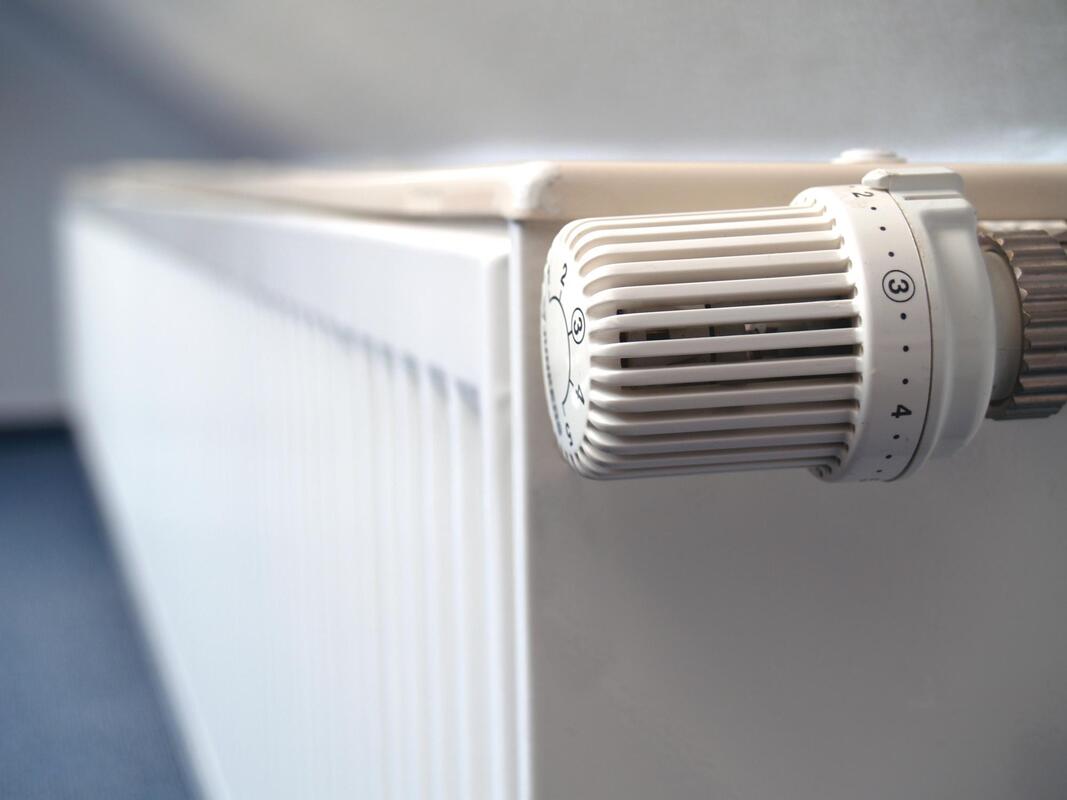a close up of a heater on a wall